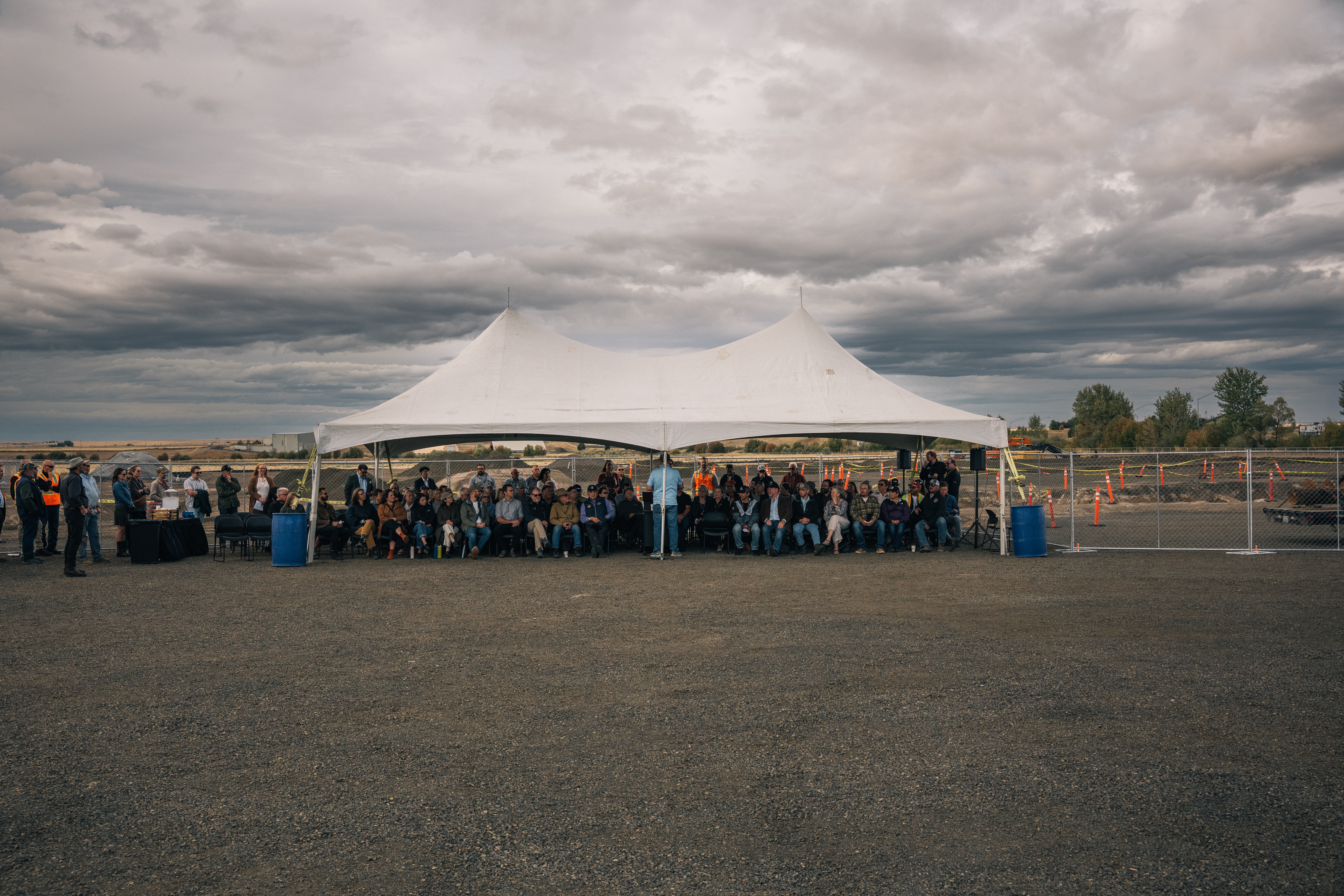A crowd gathers for some rare good news in Pacific Northwest wheat country, which has been reeling from low wheat prices and uncertainty over a trade war.